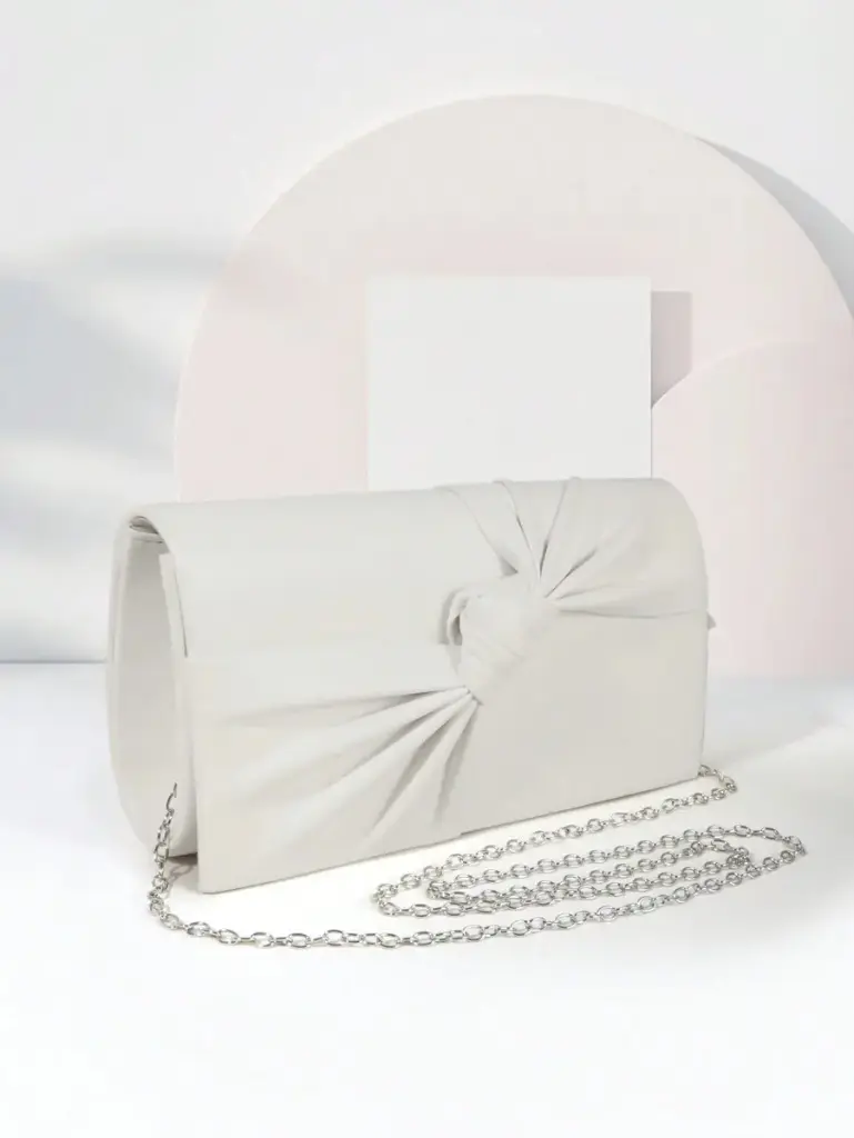 Bolso de mano con nudo cruzado